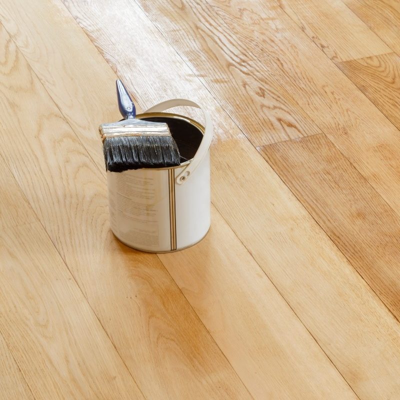 Wood Finish Can on Hardwood Floor